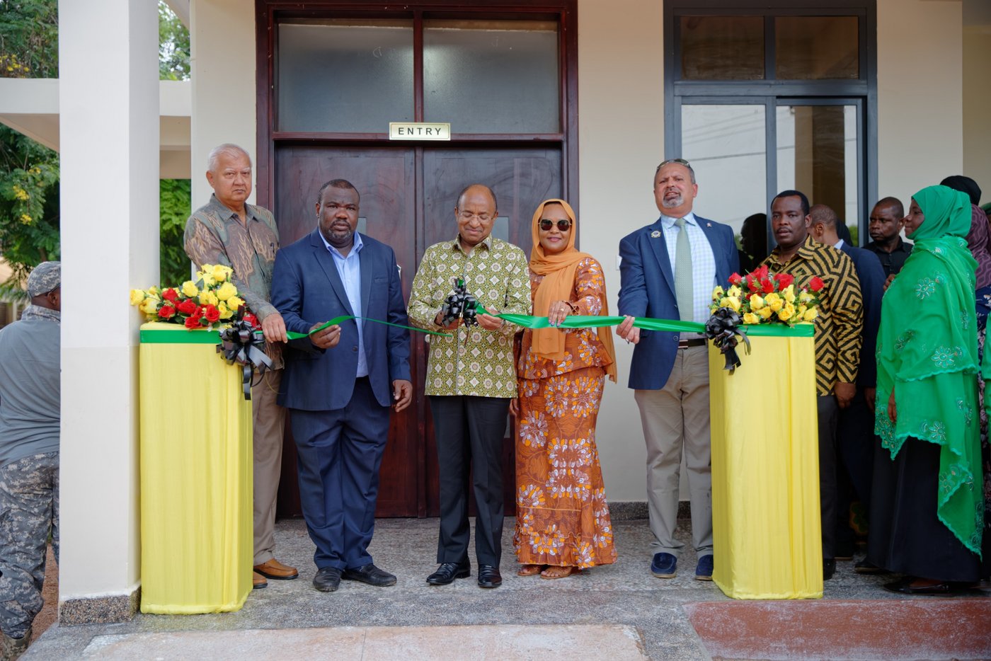 Eight country leaders cutting the ribbon on opening day of the new laboratory in Zanzibar, Tanzania