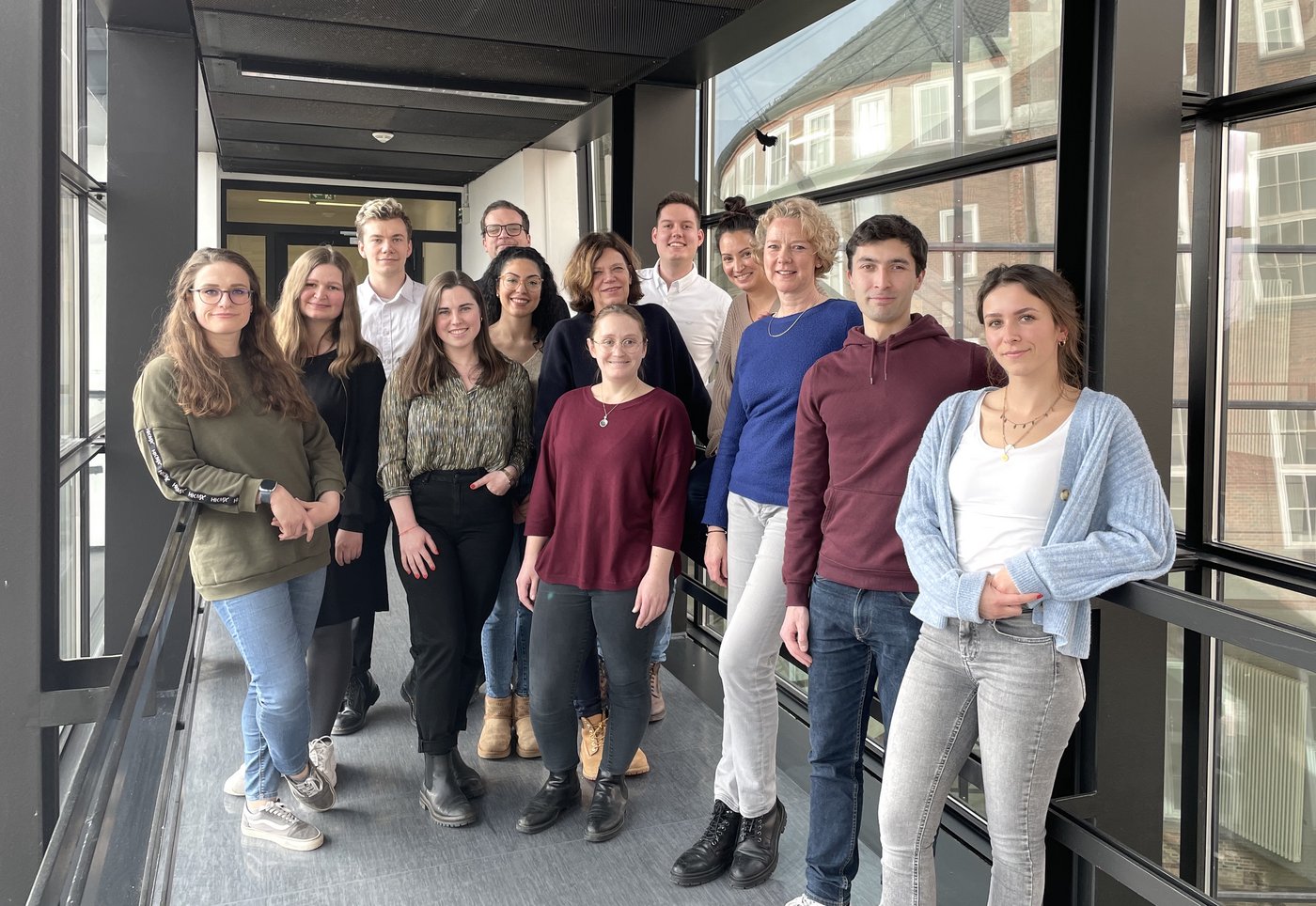 The research group Molecular Infection Immunology, together with their group leader Hanna Lotter, stand in the transition from t