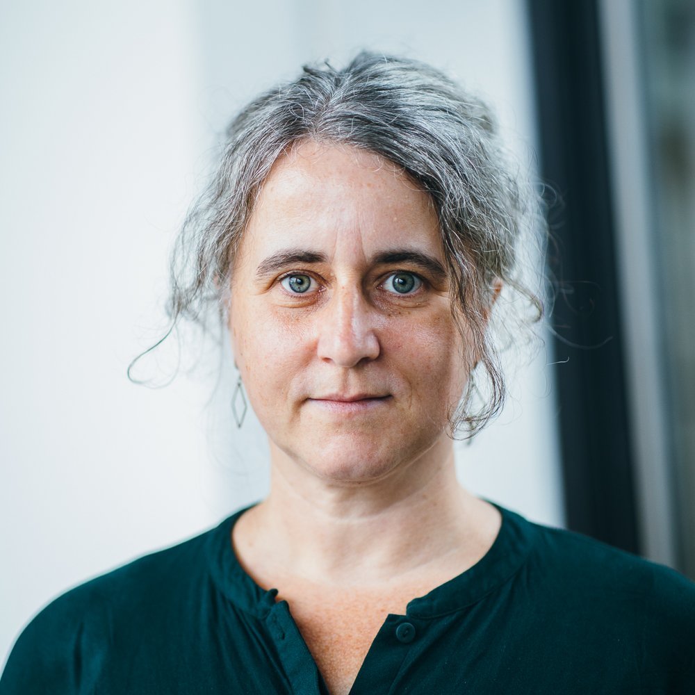 Dr. Nicole Wiederrroth female, white person with a dark green shirt