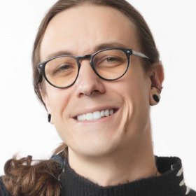 Photo of George Neuhaus Person with glases and long brown hair.