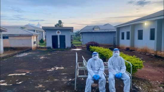 Two medical staff in protective suits 