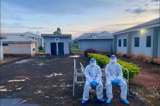 Two medical staff in protective suits 