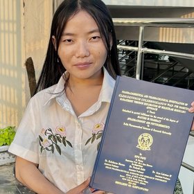 Photo of Kipa Pape Photo showing Kipa Pape, a dark-haired person with a certificate in their hand