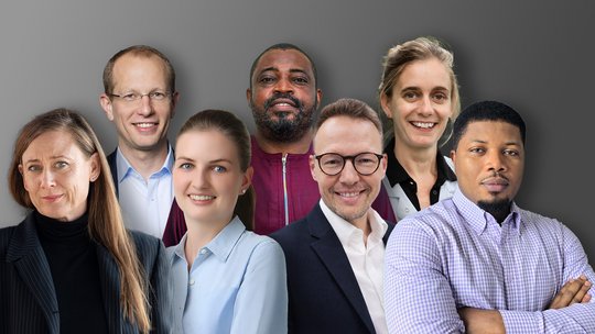 The photo collage shows seven people, four in the front row and three in the back row.