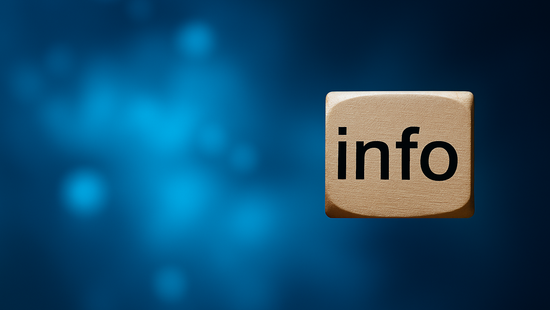 Beige keyboard keypad with black inscription 'info' against a blurred blue background