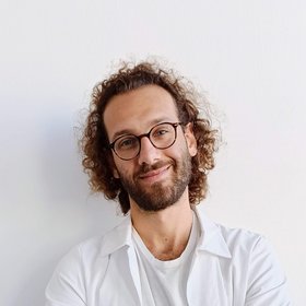 Gabriele Diana Researcher with glasses is looking into the camera