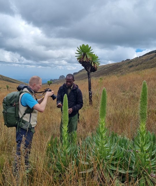 The photo shows Fabien Schultz talking with one of the rangers.