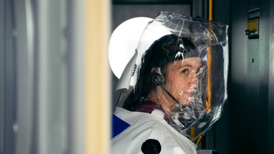 Scientist in a protective suit