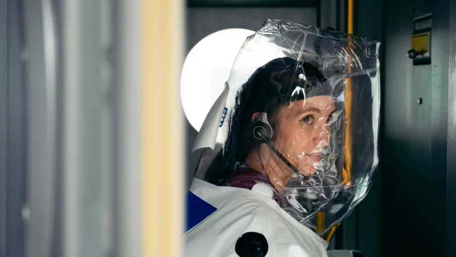 Cover Scientist in a protective suit