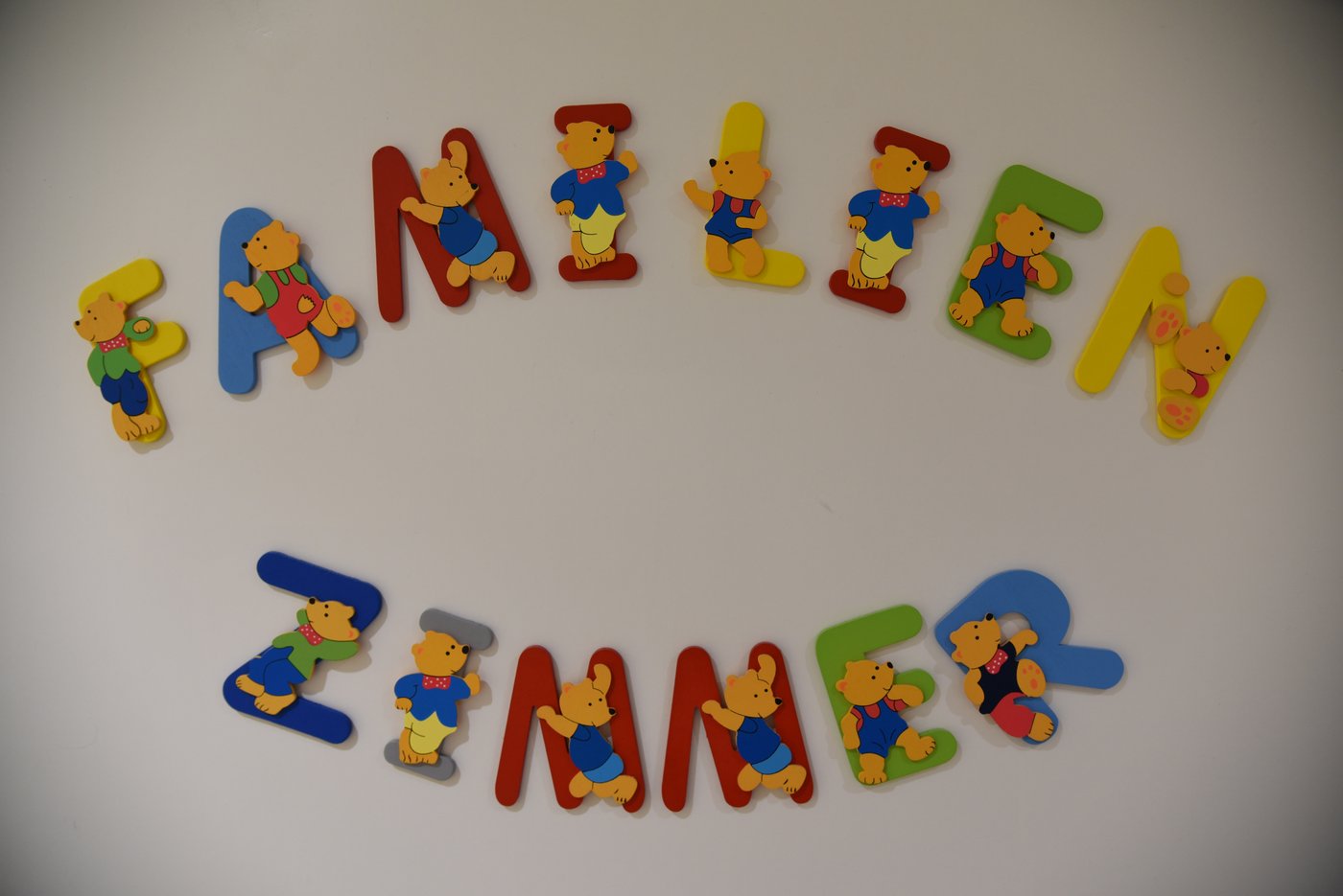 White door of the family room with the word "Family Room" in colourful letters