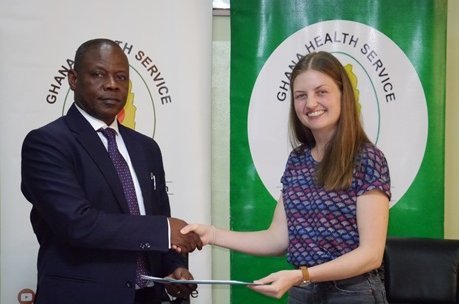 MOU signature Handshake between Director of Ghana Health Service and Lab Group leader of BNITM after MOU signature