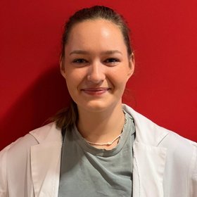 Henrike Wurm Henrike Wurm, a researcher with brown hair, smiles warmly while wearing a white coat, embodying the spirit of scientific research.