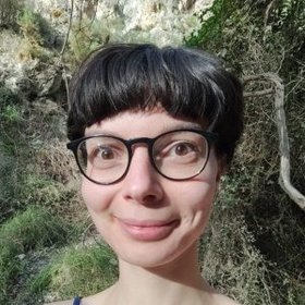 Photo of Luna Mafo Photo of a person with dark hair and glasses.