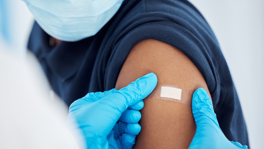 Close-up of an arm with a plaster following a vaccination