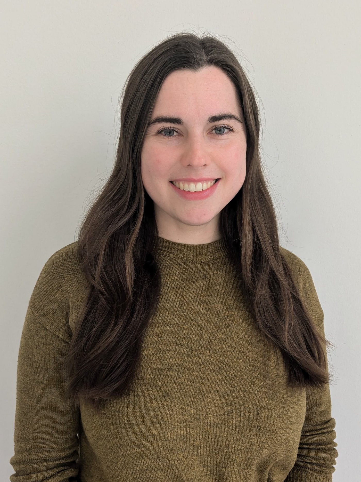 A smiling woman against a white background