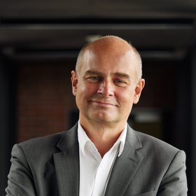 Portrait photo of Prof. Dr Jürgen May: an experienced researcher who is looking friendly towards the camera