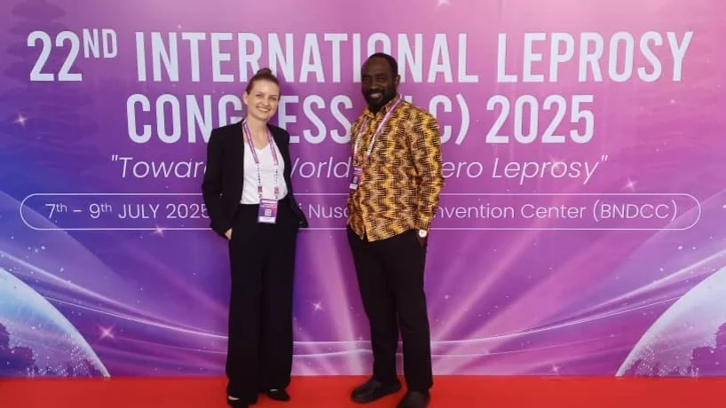 Picture of research partners in front of ILC 2025 banner