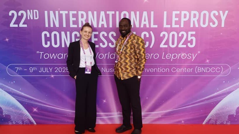 Picture of research partners in front of ILC 2025 banner