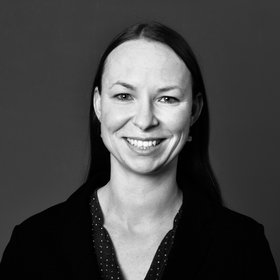 Dr. Maria Rosenthal: a researcher wearing long hair and a blouse. The picture is black and white.