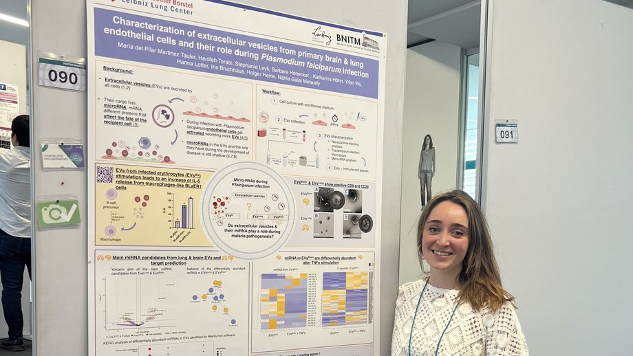 Young scientist presenting a poster