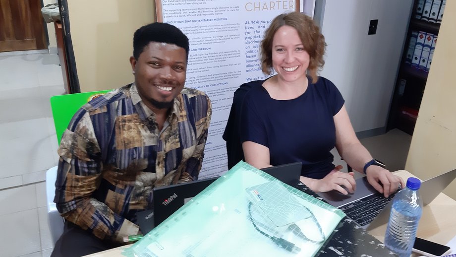 The picture shows a man and a woman working together in an office, sitting at a desk. Monitoring visit at the SAFARI trial site at FMCO, Nigeria.